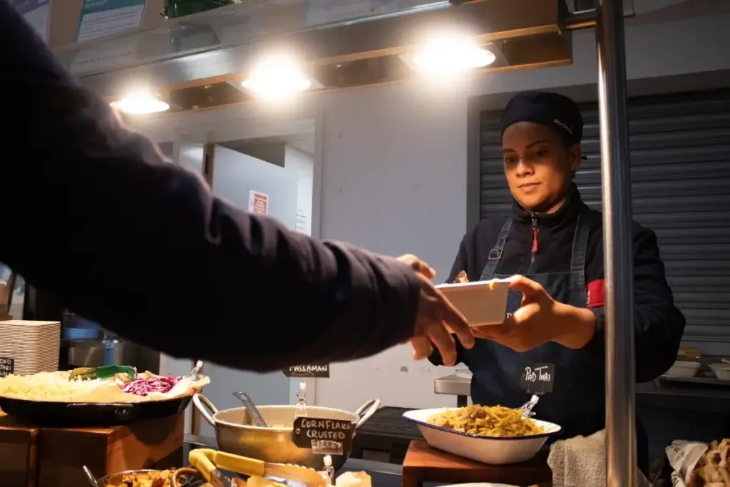 Chef-serving-smiling-1024x683 (1).webp